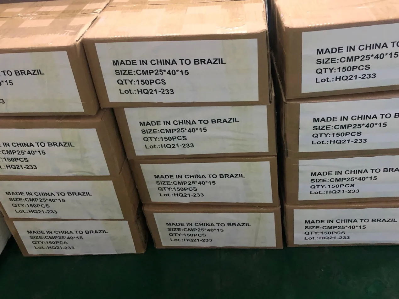 Stacked brown export cartons with white labels reading Made in China to Brazil